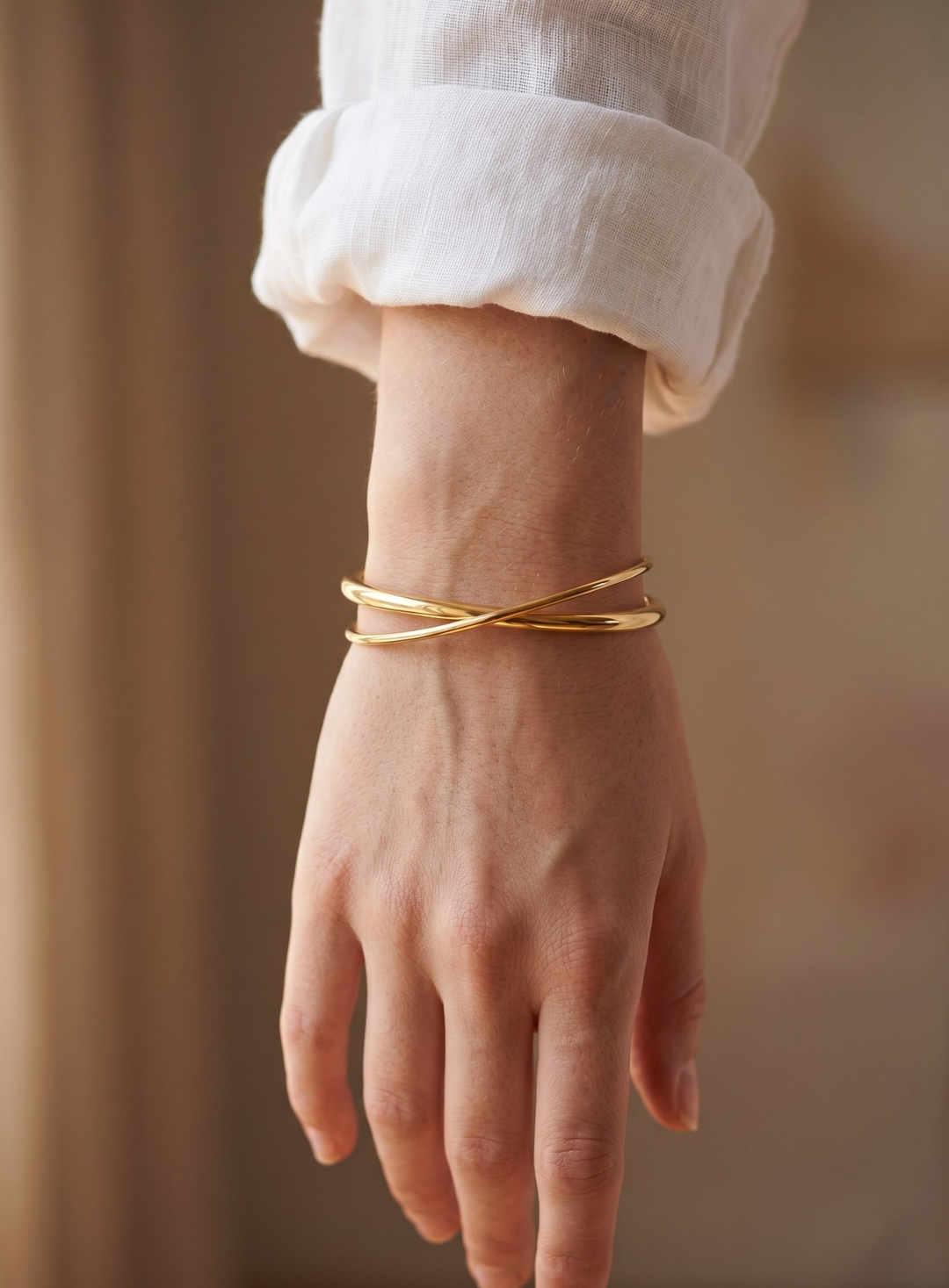 Krydsformet armbånd