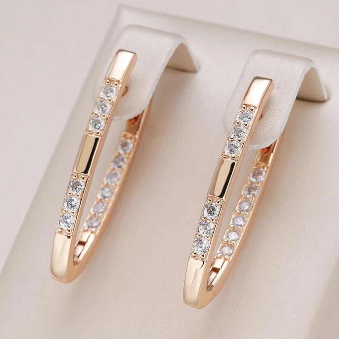 Elegante zirconitøreringe i guld