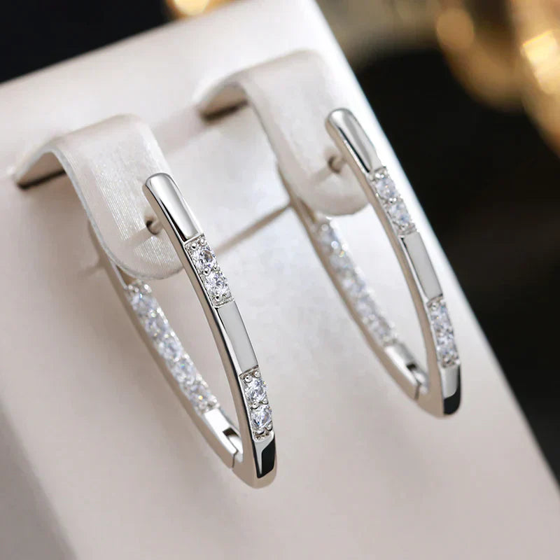Elegante zirconitøreringe i guld