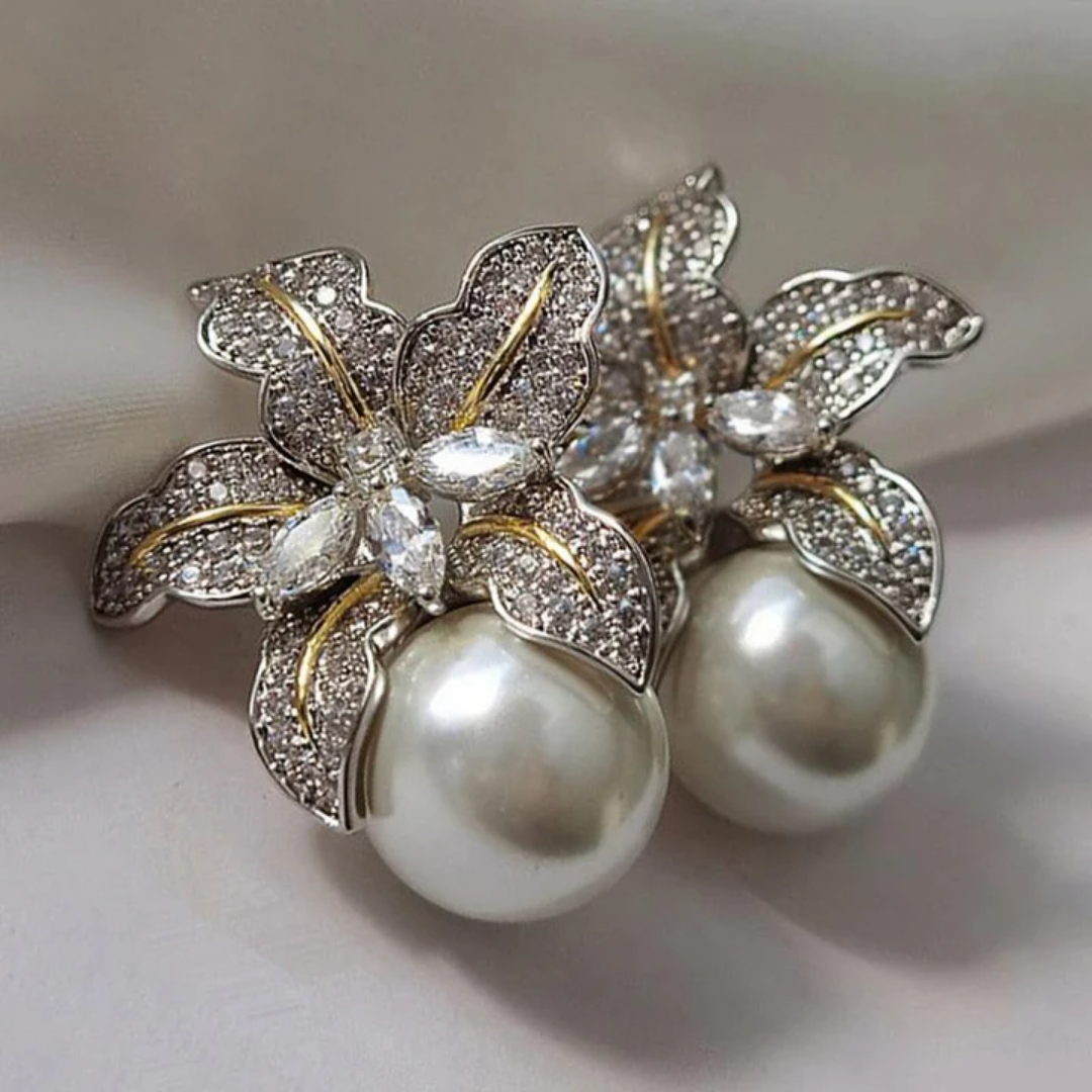 Elegante øreringe med blomst og perle